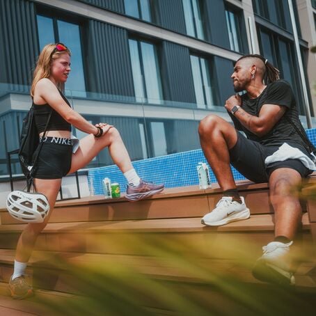 Athletes stretching on steps during World for Life Run 2025 event in Barcelona