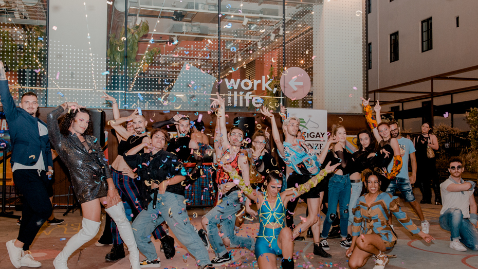 Group of people posing during a pride event