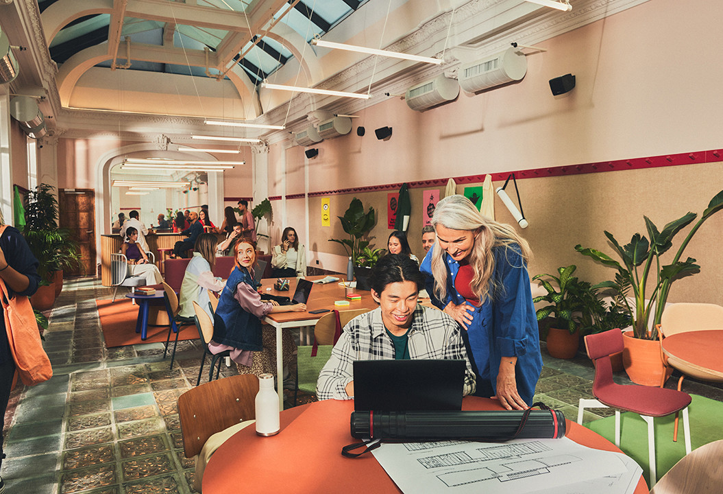 People working together in the communal area at The Social Hub